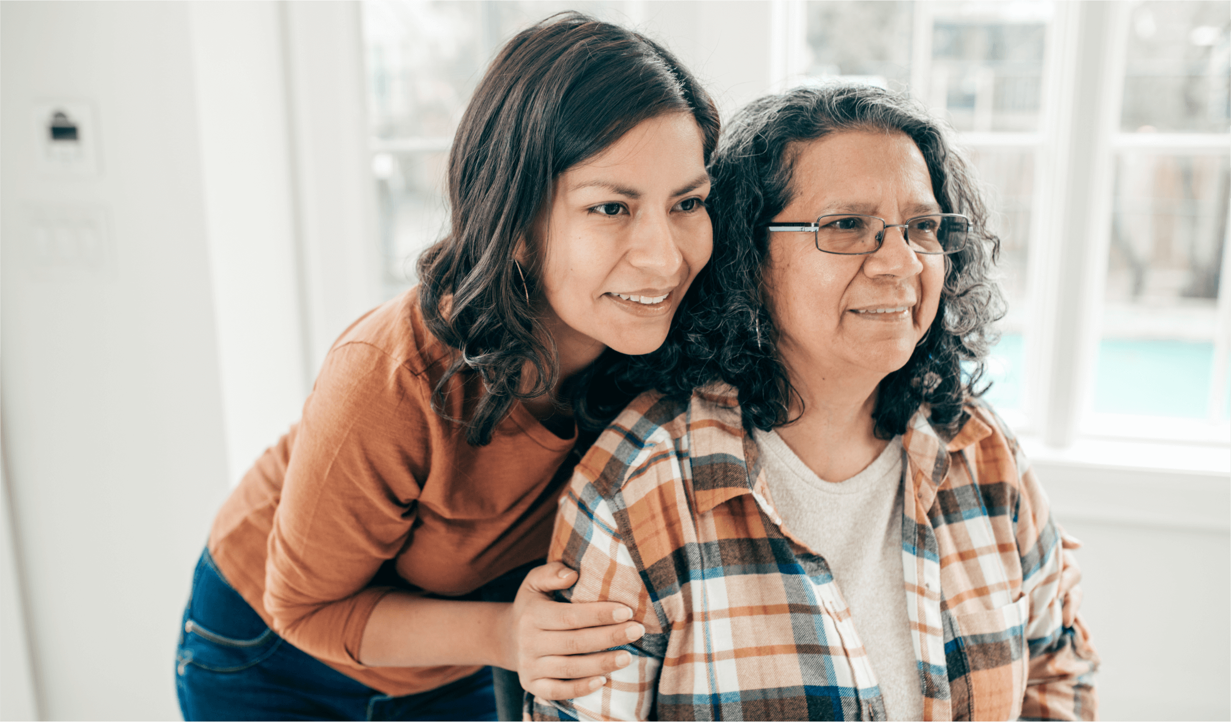 women holding elderly women